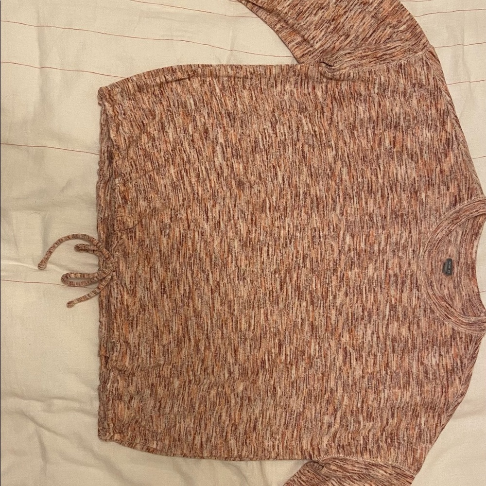 Medium Aerie soft sweater with tie in the front.